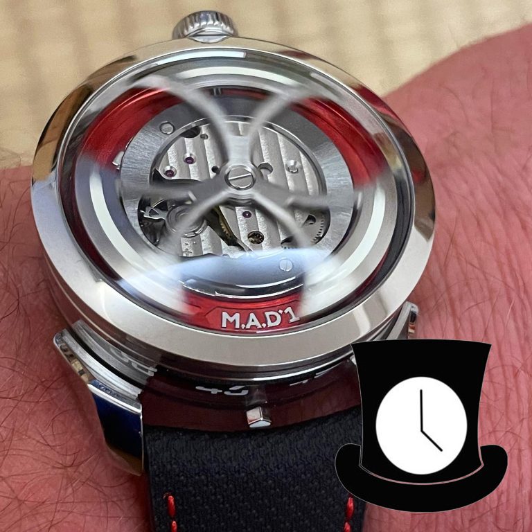 embezeled mad1 red dial